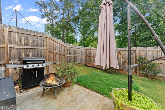 61 N Auburn Landing Pl, Auburn, GA 30011 - view of yard featuring an outdoor fire pit and a patio