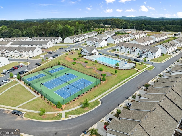 61 N Auburn Landing Pl, Auburn, GA 30011 - aerial perspective of suburban area with a pool area and a heavily wooded area