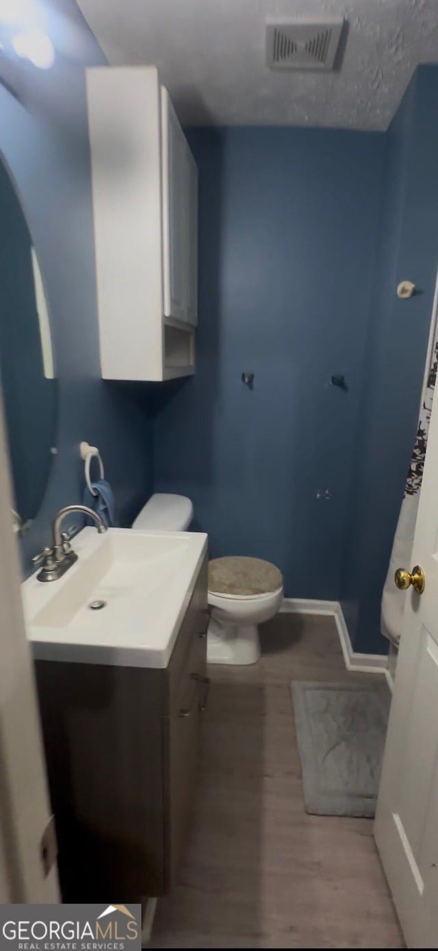 1794 Fielding Way, Hampton, GA 30228 - half bathroom with vanity and wood finished floors