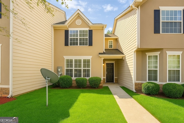 7432 Battlecreek Ln, Jonesboro, GA 30236 - view of property with a front yard and stucco siding