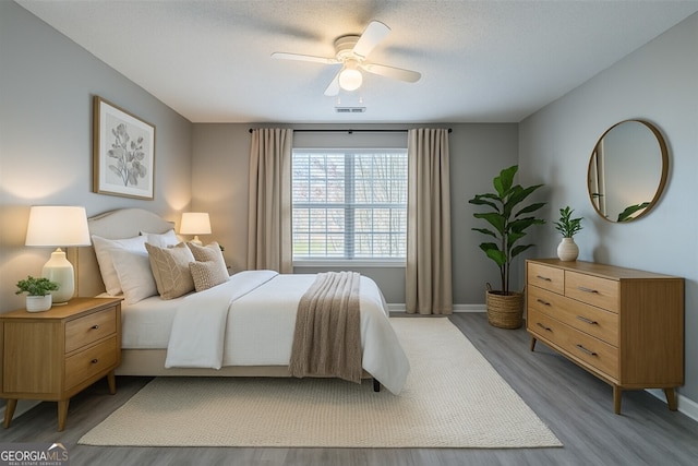 7432 Battlecreek Ln, Jonesboro, GA 30236 - bedroom featuring wood finished floors and a ceiling fan