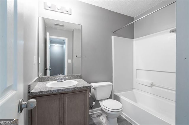 7432 Battlecreek Ln, Jonesboro, GA 30236 - full bathroom featuring vanity, shower / bathtub combination, and a textured ceiling