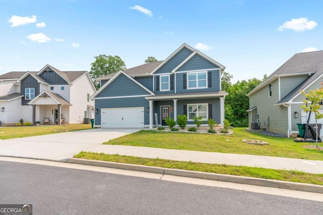 125 Kingston Cir, Carrollton, GA 30117 - craftsman inspired home with driveway, a front yard, an attached garage, and a porch