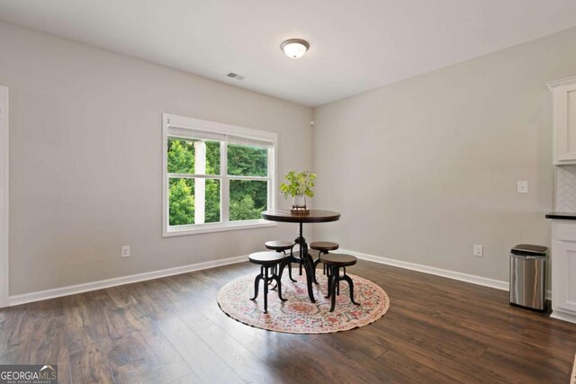 125 Kingston Cir, Carrollton, GA 30117 - dining room featuring dark wood-style flooring and baseboards