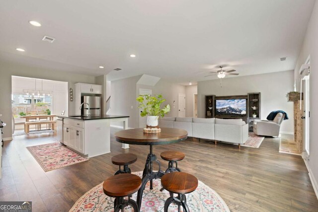 125 Kingston Cir, Carrollton, GA 30117 - dining space with wood finished floors, a ceiling fan, baseboards, and recessed lighting