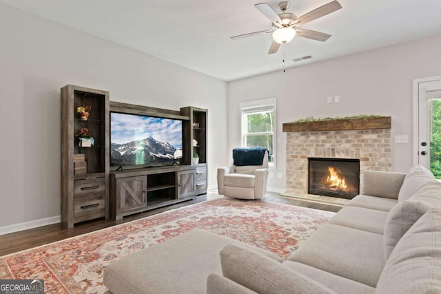 125 Kingston Cir, Carrollton, GA 30117 - living area with wood finished floors, baseboards, ceiling fan, and a fireplace