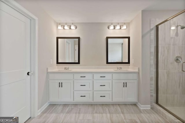 125 Kingston Cir, Carrollton, GA 30117 - full bathroom with a stall shower, double vanity, and baseboards