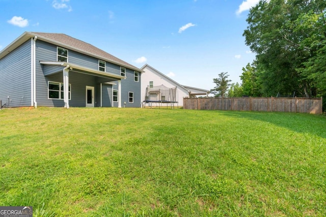 125 Kingston Cir, Carrollton, GA 30117 - rear view of property featuring a trampoline