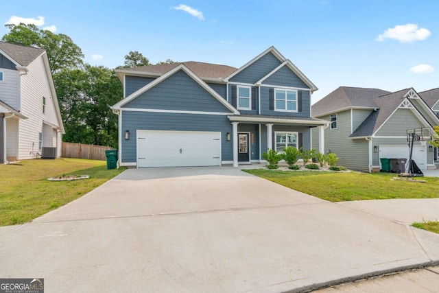 125 Kingston Cir, Carrollton, GA 30117 - craftsman house with cooling unit, driveway, a garage, and a porch