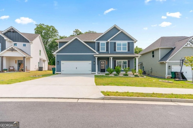 125 Kingston Cir, Carrollton, GA 30117 - craftsman-style house with concrete driveway, a front lawn, covered porch, and an attached garage