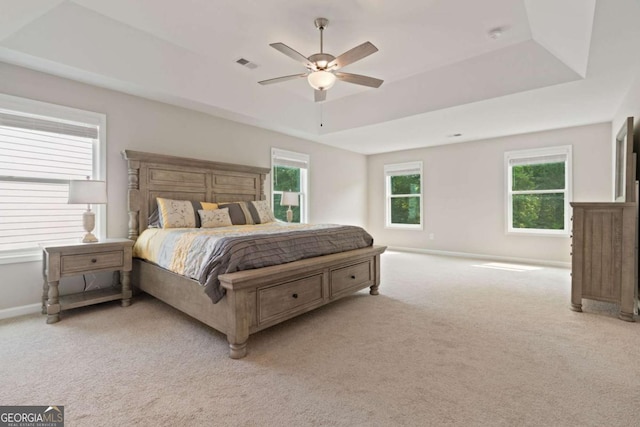 125 Kingston Cir, Carrollton, GA 30117 - bedroom featuring light colored carpet, a tray ceiling, baseboards, and ceiling fan
