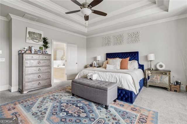 10 Nesbit Reserve Ct, Atlanta, GA 30350 - carpeted bedroom featuring a tray ceiling, ornamental molding, ensuite bathroom, and ceiling fan
