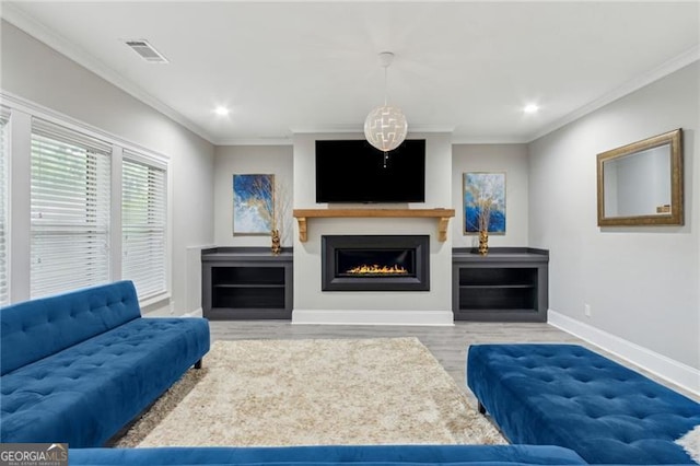 10 Nesbit Reserve Ct, Atlanta, GA 30350 - living room with wood finished floors, a warm lit fireplace, crown molding, and recessed lighting