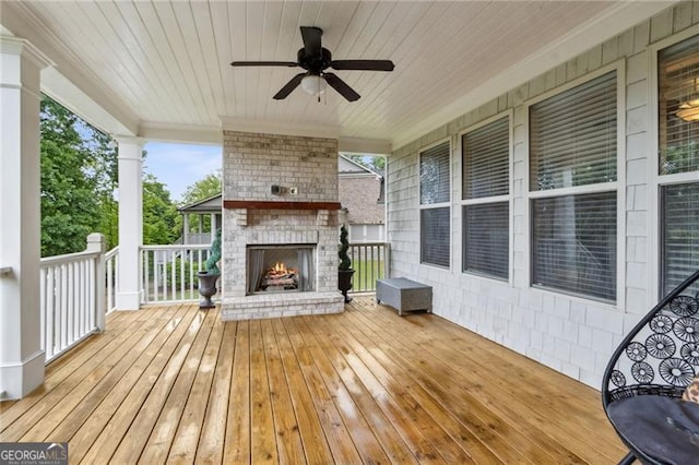 10 Nesbit Reserve Ct, Atlanta, GA 30350 - wooden deck with an outdoor brick fireplace and a ceiling fan