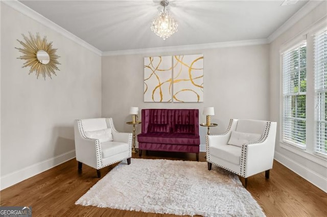10 Nesbit Reserve Ct, Atlanta, GA 30350 - living area featuring crown molding, healthy amount of natural light, a chandelier, and wood finished floors