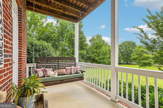 3480 Indian Shoals Rd, Dacula, GA 30019 - covered porch with view of scattered trees