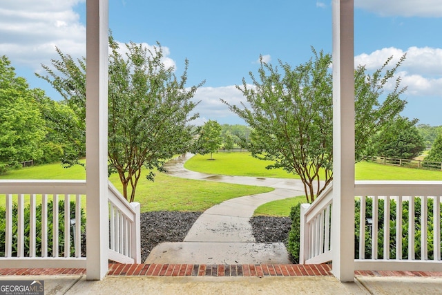 3480 Indian Shoals Rd, Dacula, GA 30019 - view of green lawn with covered porch