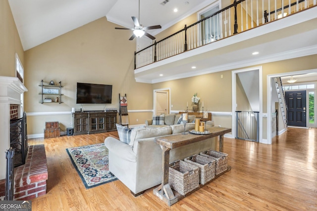 3480 Indian Shoals Rd, Dacula, GA 30019 - living room featuring high vaulted ceiling, ornamental molding, wood finished floors, and a ceiling fan