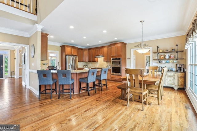 3480 Indian Shoals Rd, Dacula, GA 30019 - dining room featuring crown molding, light wood-style flooring, and recessed lighting