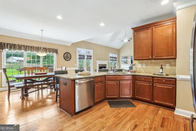 3480 Indian Shoals Rd, Dacula, GA 30019 - kitchen with stainless steel dishwasher, a peninsula, light wood finished floors, ceiling fan, and decorative backsplash