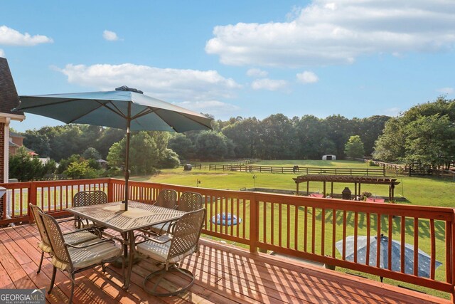3480 Indian Shoals Rd, Dacula, GA 30019 - wooden deck with outdoor dining area and a lawn