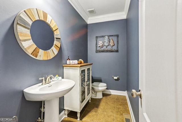 3480 Indian Shoals Rd, Dacula, GA 30019 - bathroom with crown molding, toilet, baseboards, and tile patterned floors