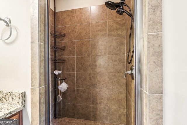 3480 Indian Shoals Rd, Dacula, GA 30019 - full bath featuring a tile shower and vanity