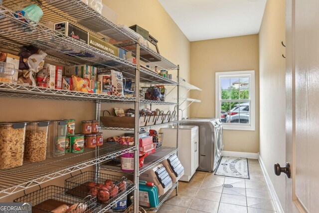 3480 Indian Shoals Rd, Dacula, GA 30019 - laundry area with washer and dryer, tile patterned floors, and baseboards