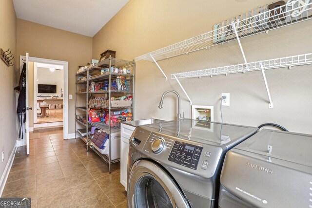3480 Indian Shoals Rd, Dacula, GA 30019 - washroom featuring washer and clothes dryer, tile patterned floors, baseboards, and cabinet space