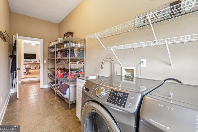 3480 Indian Shoals Rd, Dacula, GA 30019 - washroom with washer and dryer, tile patterned floors, and cabinet space
