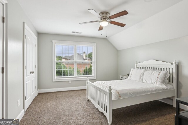 3480 Indian Shoals Rd, Dacula, GA 30019 - bedroom with carpet floors, vaulted ceiling, baseboards, and ceiling fan