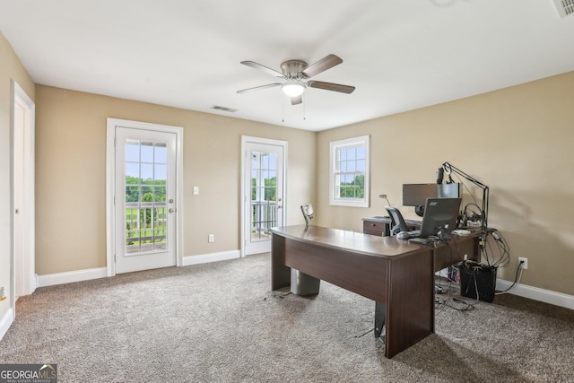 3480 Indian Shoals Rd, Dacula, GA 30019 - home office featuring a ceiling fan, carpet floors, and plenty of natural light