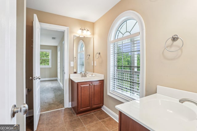 3480 Indian Shoals Rd, Dacula, GA 30019 - bathroom featuring vanity, baseboards, and tile patterned floors