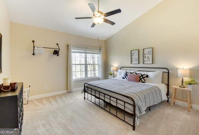 243 Degroff Ln, Rabun Gap, GA 30568 - bedroom featuring baseboards, light carpet, lofted ceiling, and ceiling fan