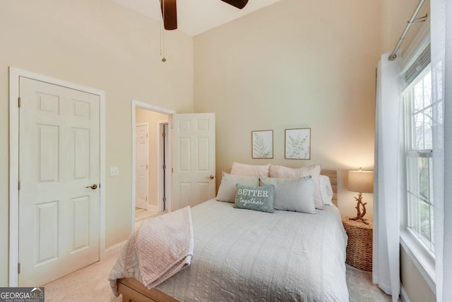 243 Degroff Ln, Rabun Gap, GA 30568 - bedroom with a towering ceiling, carpet, a ceiling fan, and baseboards