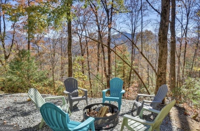243 Degroff Ln, Rabun Gap, GA 30568 - view of patio / terrace featuring a fire pit and a view of trees