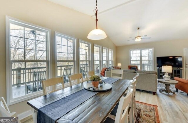 243 Degroff Ln, Rabun Gap, GA 30568 - dining room with light wood finished floors, vaulted ceiling, and ceiling fan