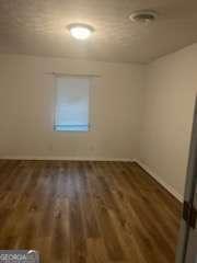 3785 Somerset Dr SW, Marietta, GA 30064 - empty room featuring wood finished floors