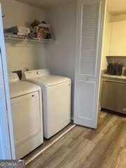 3785 Somerset Dr SW, Marietta, GA 30064 - laundry room with washing machine and clothes dryer and wood finished floors
