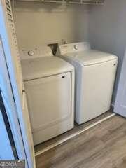 3785 Somerset Dr SW, Marietta, GA 30064 - laundry area featuring washing machine and dryer and wood finished floors