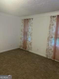3785 Somerset Dr SW, Marietta, GA 30064 - spare room with baseboards and carpet flooring