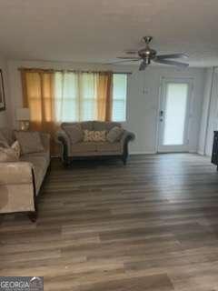 3785 Somerset Dr SW, Marietta, GA 30064 - living area with ceiling fan and wood finished floors