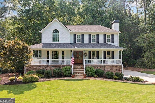226 Nacoochee Dr, Woodstock, GA 30188 - view of front of home with covered porch, french doors, a chimney, a front yard, and roof with shingles
