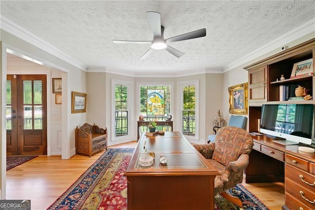 226 Nacoochee Dr, Woodstock, GA 30188 - home office featuring light wood-type flooring, a ceiling fan, french doors, ornamental molding, and built in study area