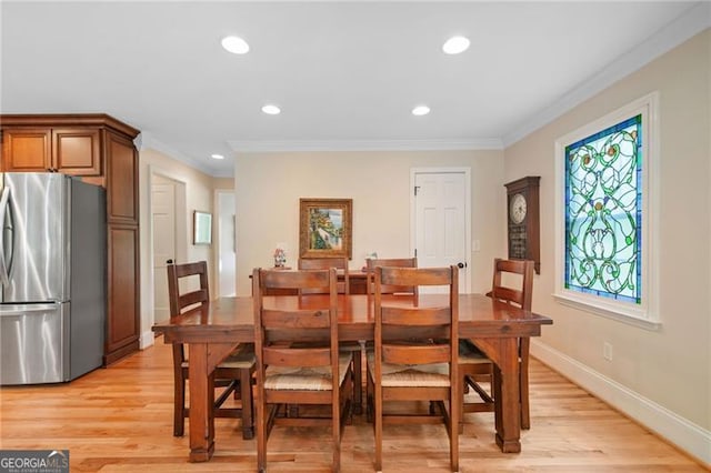 226 Nacoochee Dr, Woodstock, GA 30188 - dining room featuring ornamental molding, light wood-type flooring, and recessed lighting