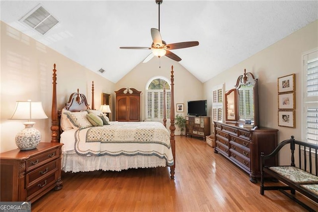 226 Nacoochee Dr, Woodstock, GA 30188 - bedroom with multiple windows, wood finished floors, vaulted ceiling, and ceiling fan