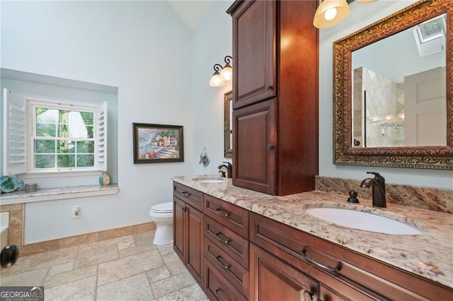 226 Nacoochee Dr, Woodstock, GA 30188 - bathroom with double vanity, a tile shower, stone finish floors, and vaulted ceiling
