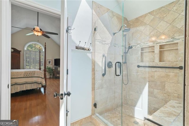 226 Nacoochee Dr, Woodstock, GA 30188 - ensuite bathroom with ceiling fan, wood finished floors, a stall shower, and vaulted ceiling