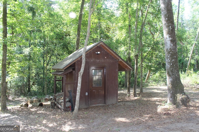 2879 Mcmillan Jernigan, Enigma, GA 31749 - view of shed featuring a forest view