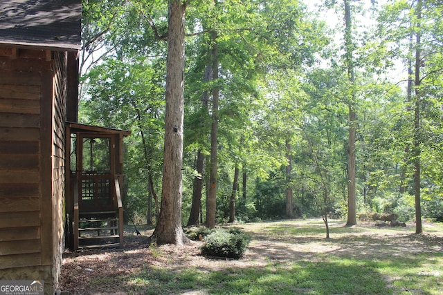 2879 Mcmillan Jernigan, Enigma, GA 31749 - view of yard with a forest view